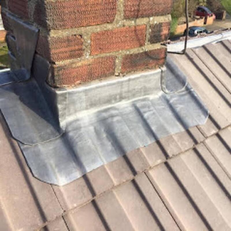 A picture of new roof flashing fitted by Roofers Sheffield around a chimney stack.